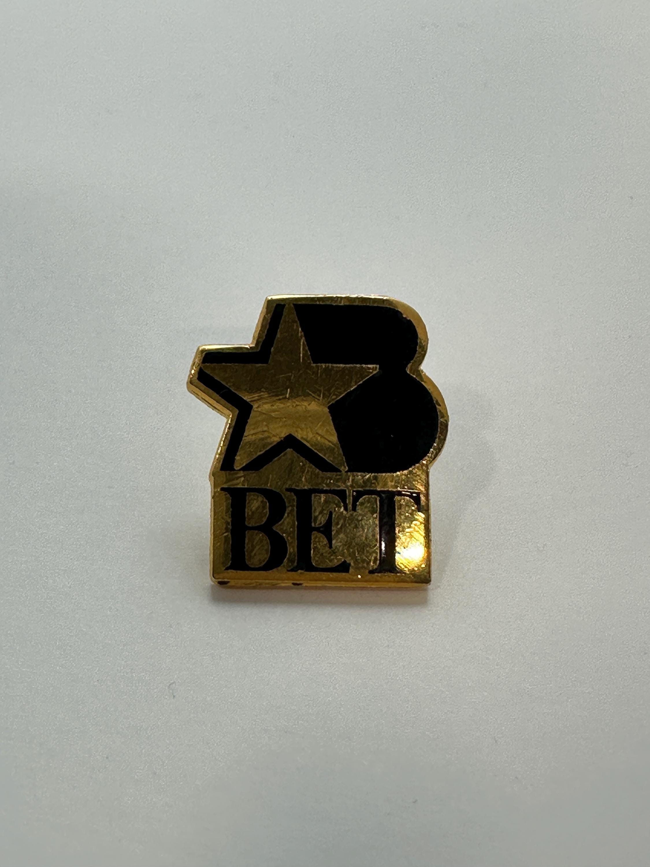 BET Logo Enamel Pin: Black & Gold Finish - Retro TV Accessory