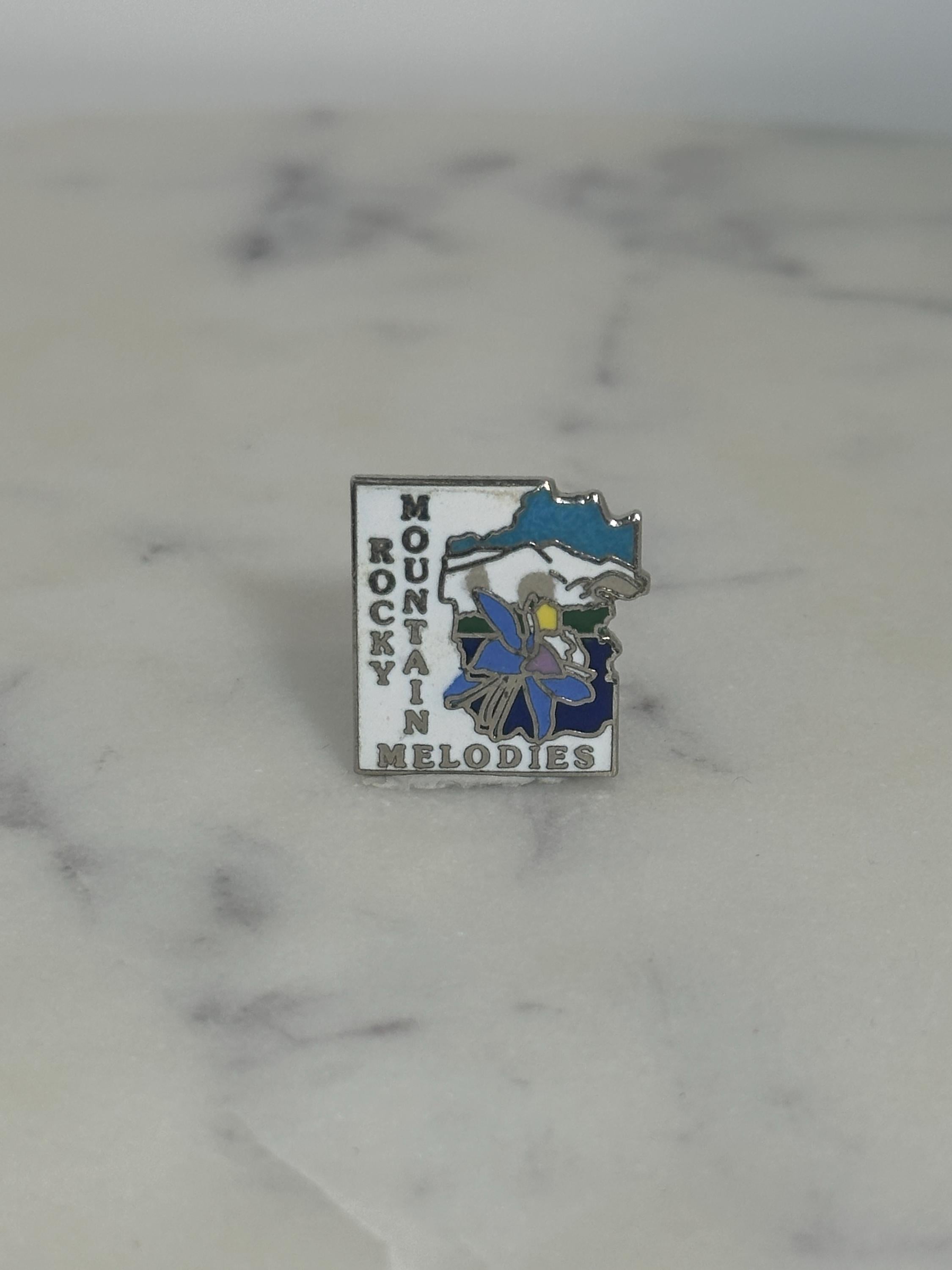 Rocky Mountain Melodies Enamel Pin: Blue Floral Scenic - Vintage Travel Accessory