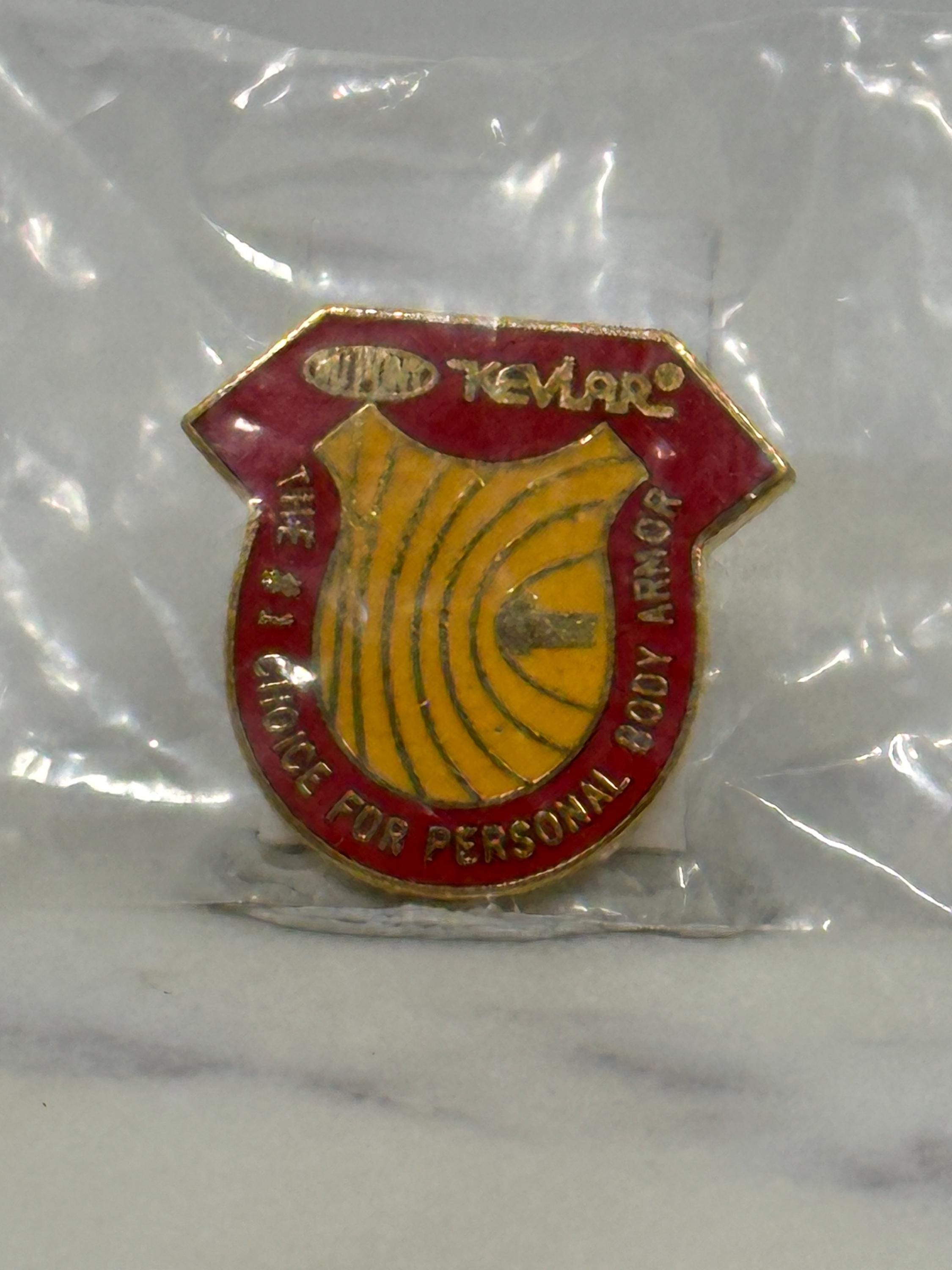 Kevlar Shield Enamel Pin: Red & Yellow Goldtone - Industrial Vintage Accessory