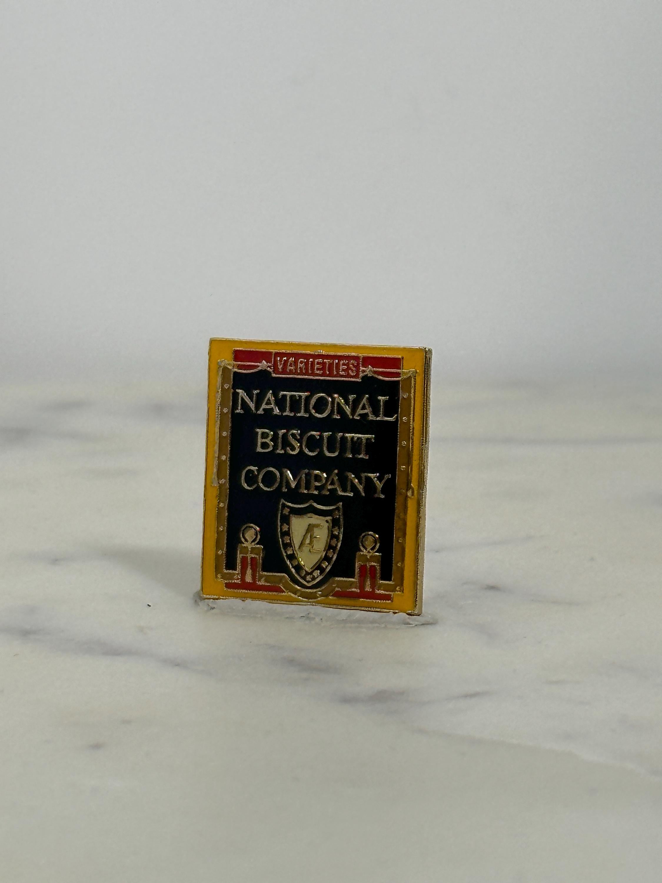 National Biscuit Company Enamel Pin: Black & Gold Rectangle - Vintage Advertising Accessory