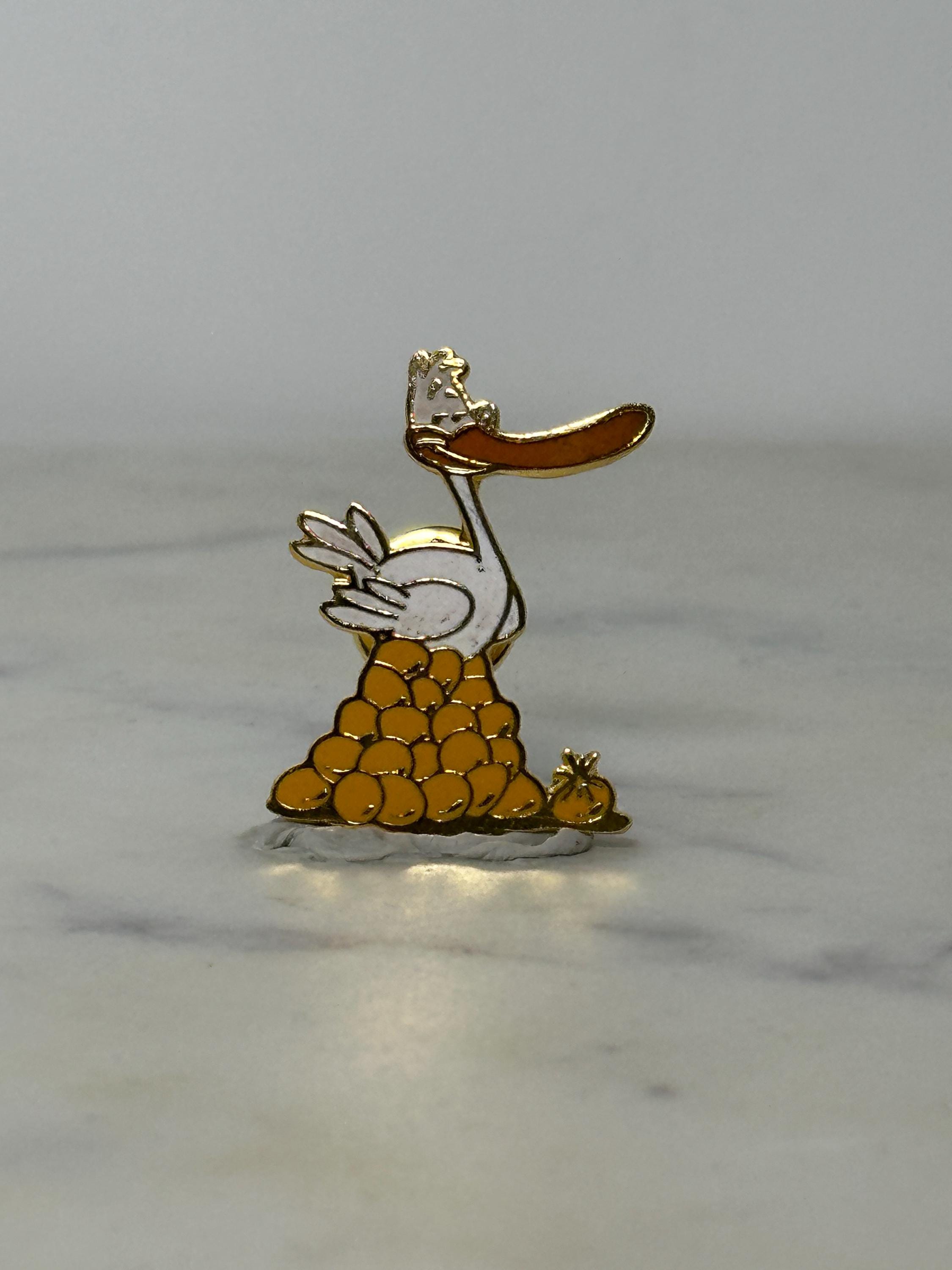 Cartoon Pelican Enamel Pin: Gold & White Finish - Retro Humor Accessory