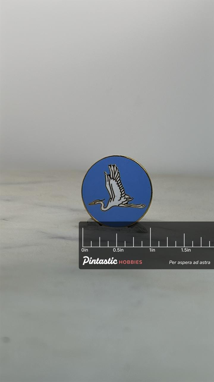 Heron Bird Enamel Pin: Blue Background Circle - Nature Lover Accessory with ruler overlay for size reference