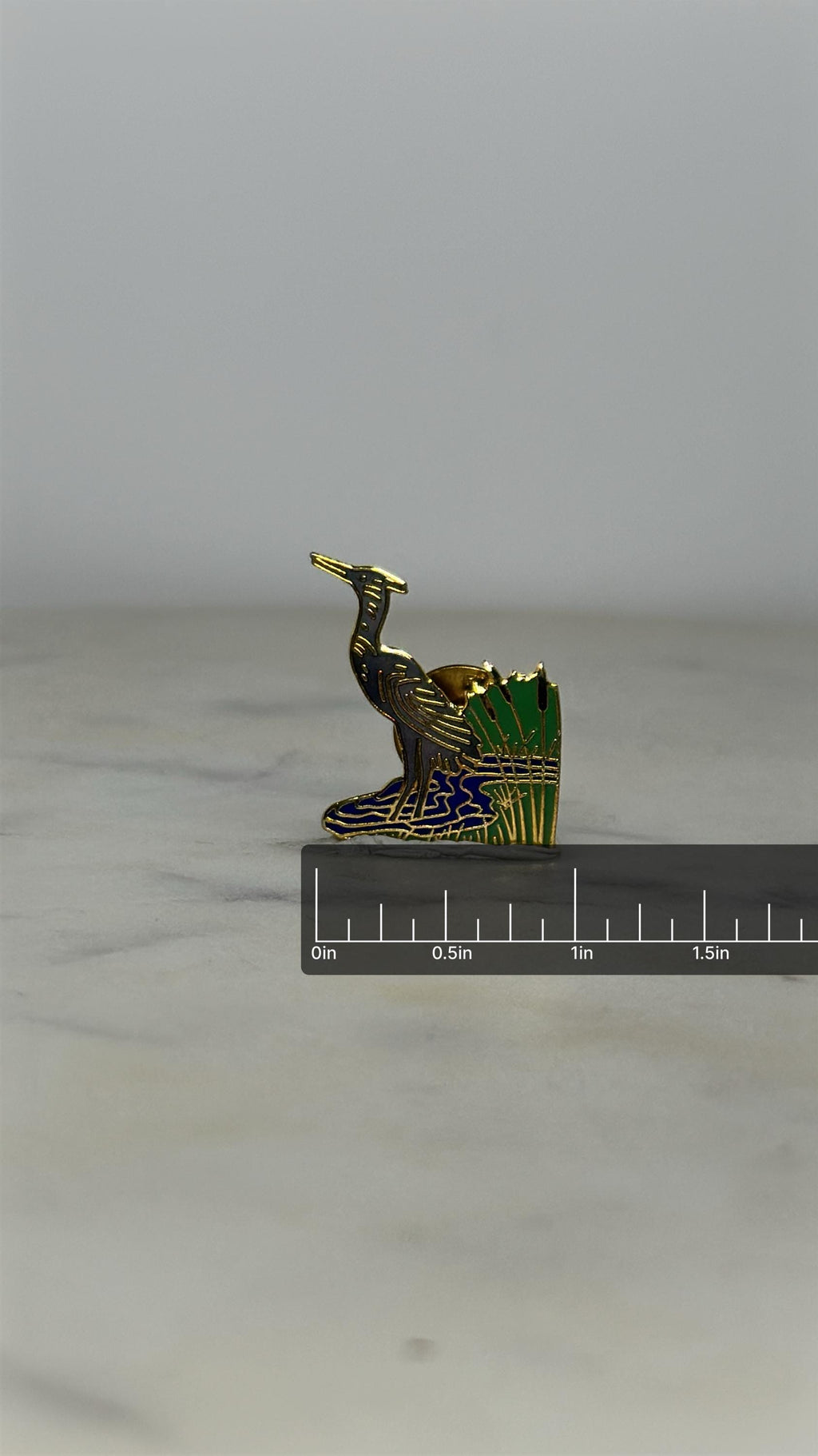 Heron Enamel Pin: Gold Tone Green & Blue - Nature Scene Accessory with ruler overlay for size reference
