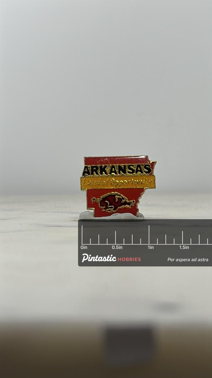 Arkansas Souvenir Enamel Pin: Red & Gold State Outline - Vintage Travel Accessory with ruler overlay for size reference
