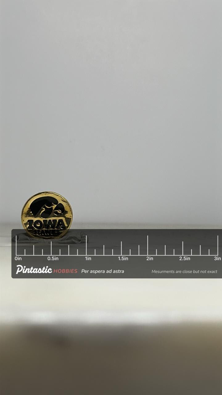 Iowa Hawkeyes Enamel Pin: Gold & Black Finish - Vintage Sports Accessory with ruler overlay for size reference