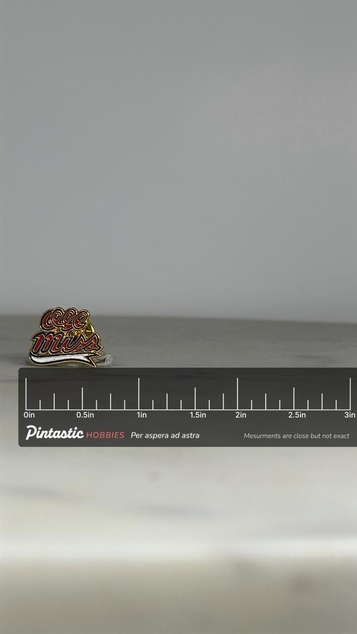 Ole Miss Enamel Pin: Red Gold Script - Vintage School Spirit Accessory with ruler overlay for size reference