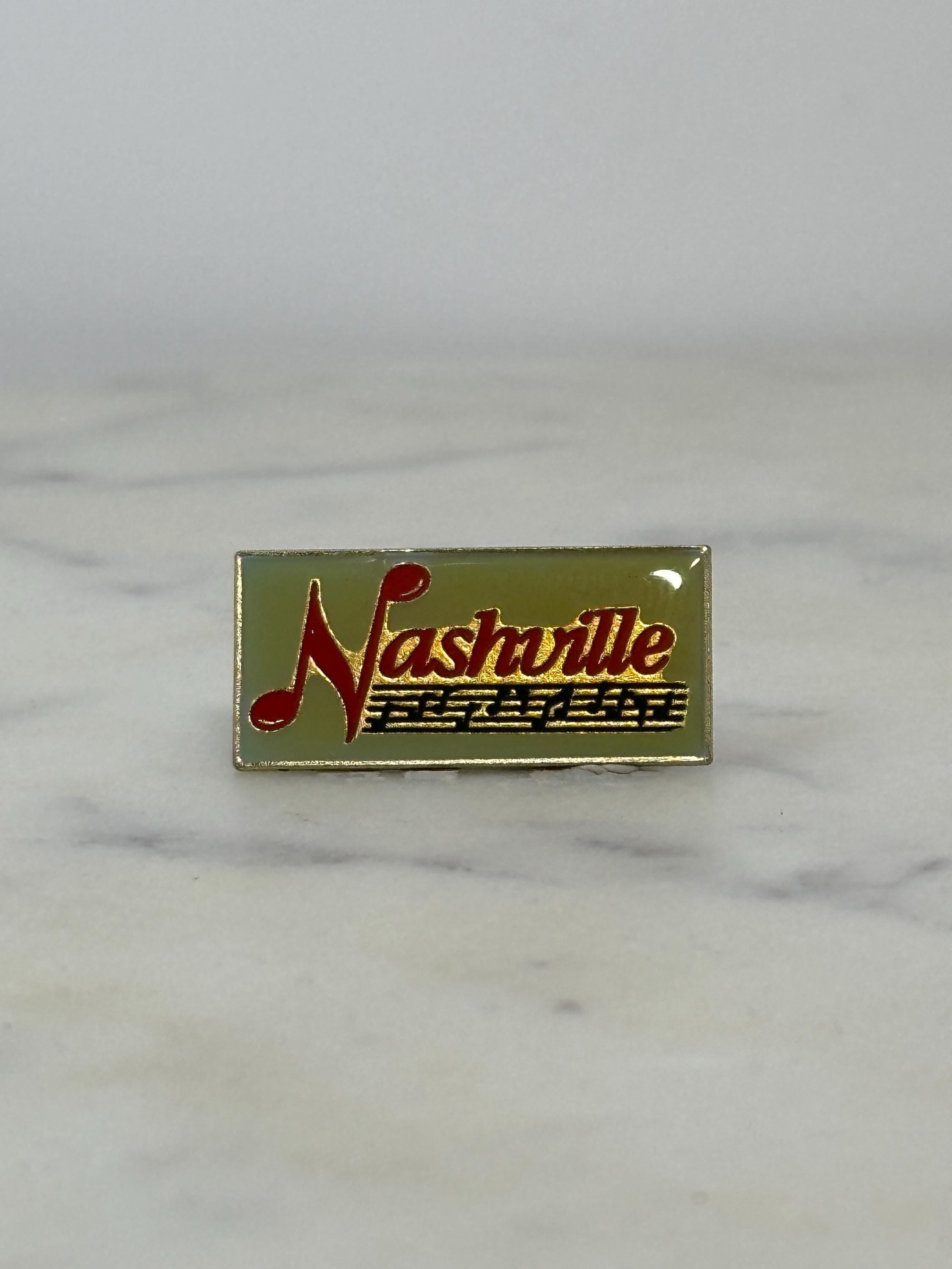 Nashville souvenir enamel pin: red gold music note - retro travel accessory