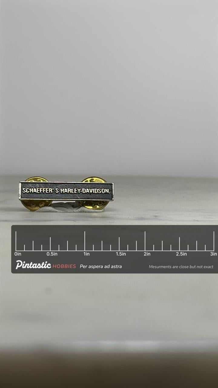 Harley-Davidson Nameplate Pin: Black Enamel & Silver Tone - Vintage Biker Accessory with ruler overlay for size reference
