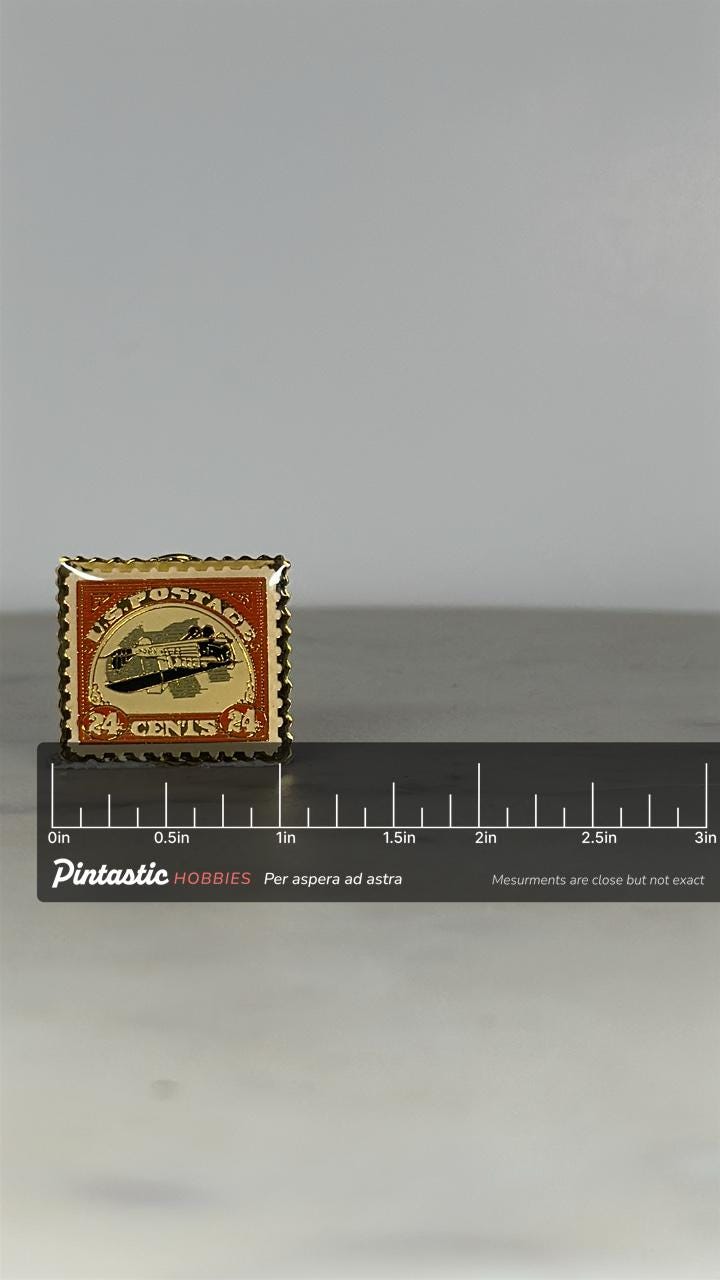 Vintage Airmail Stamp Enamel Pin: Gold & Red - Postal Collectors Accessory with ruler overlay for size reference