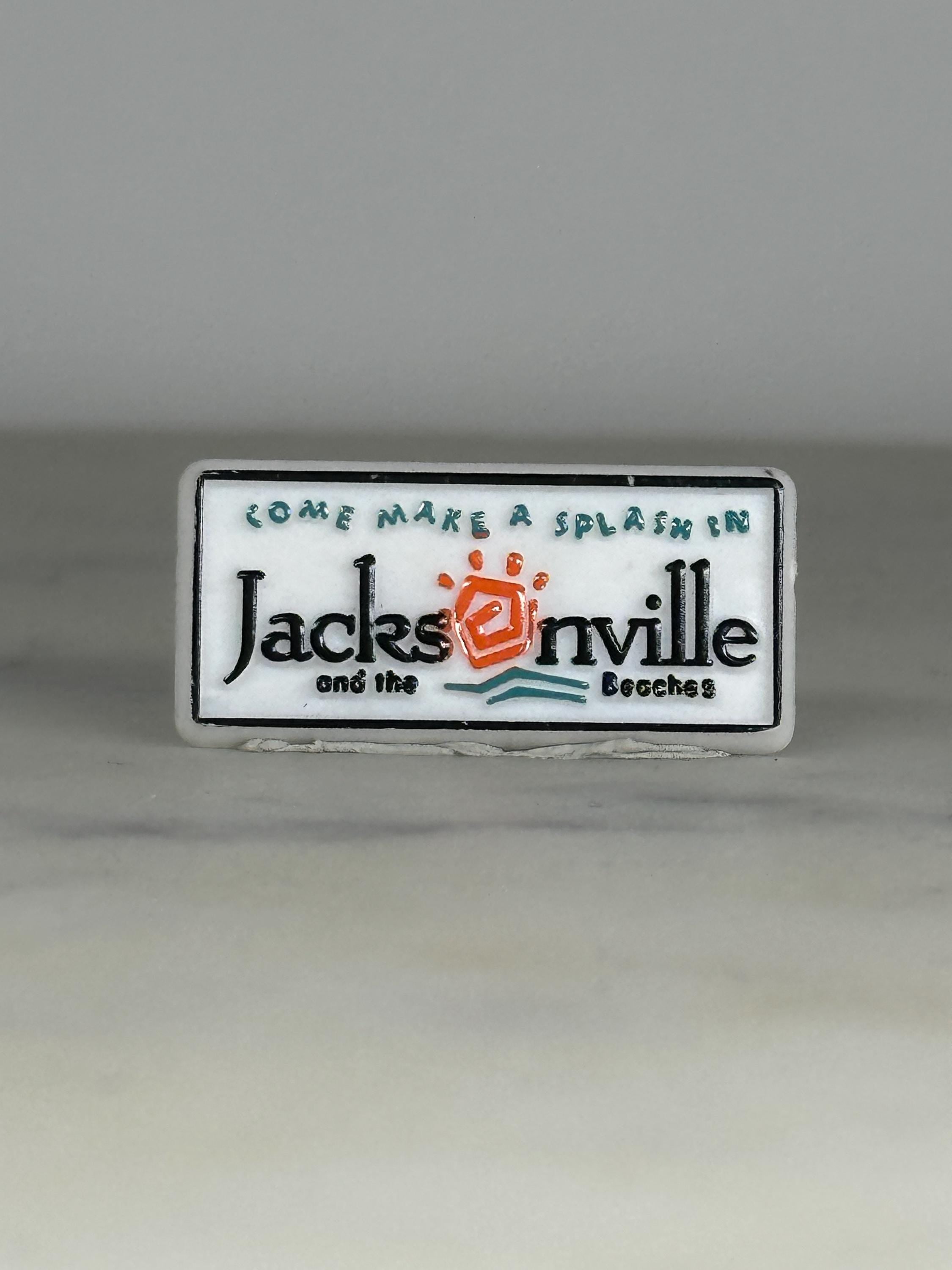 Jacksonville Souvenir Enamel Pin: White & Teal Tourist Badge - Retro Travel Accessory