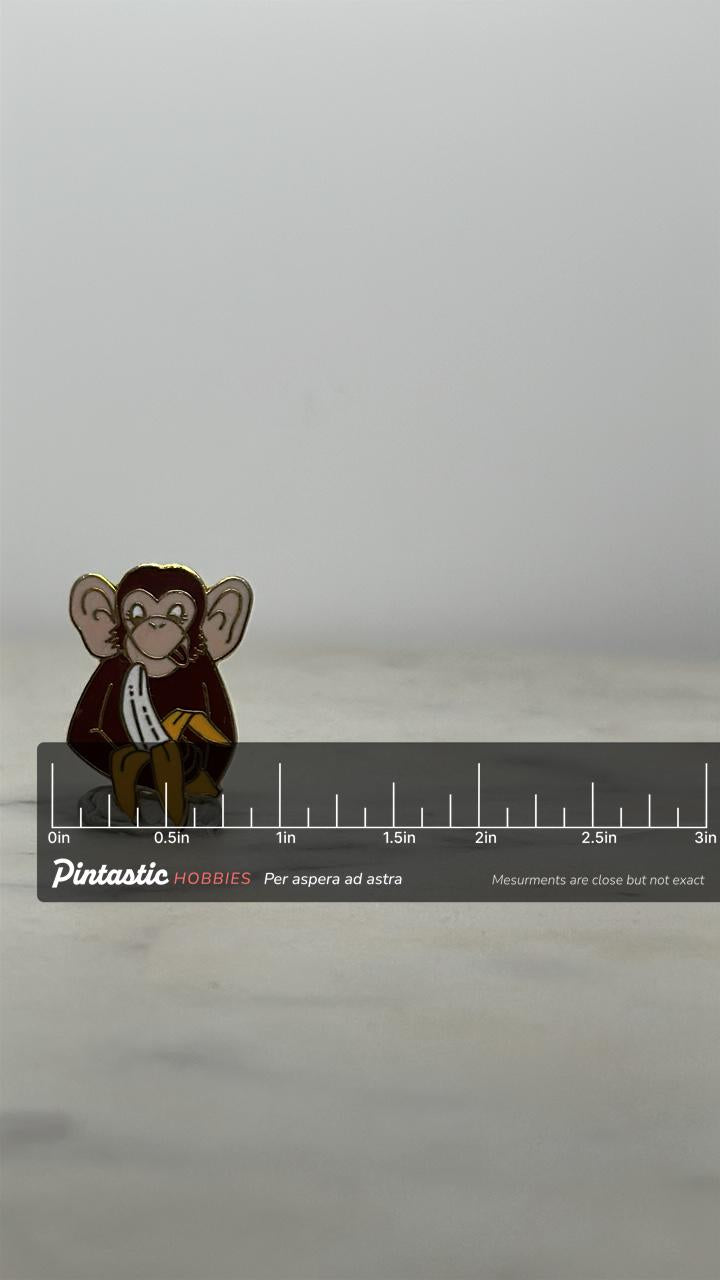 Monkey Eating Banana Enamel Pin: Yellow/Brown Cloisonné - 90s Whimsy Accessory with ruler overlay for size reference