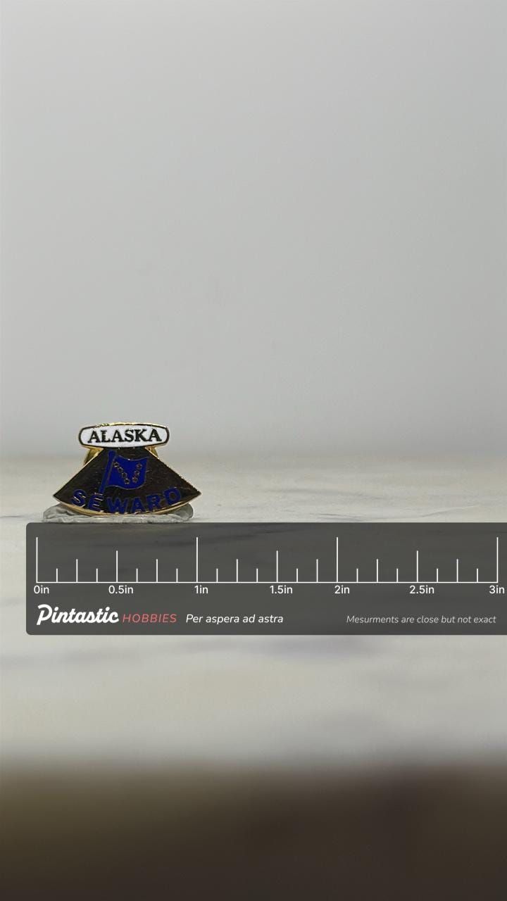 Alaska Seward Souvenir Pin: Gold Tone Enamel - Vintage Travel Accessory with ruler overlay for size reference
