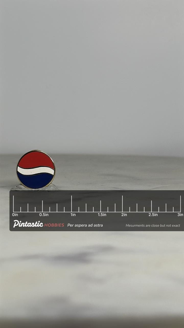 Pepsi Logo Enamel Pin: Red White Blue Round - Retro Brand Accessory with ruler overlay for size reference