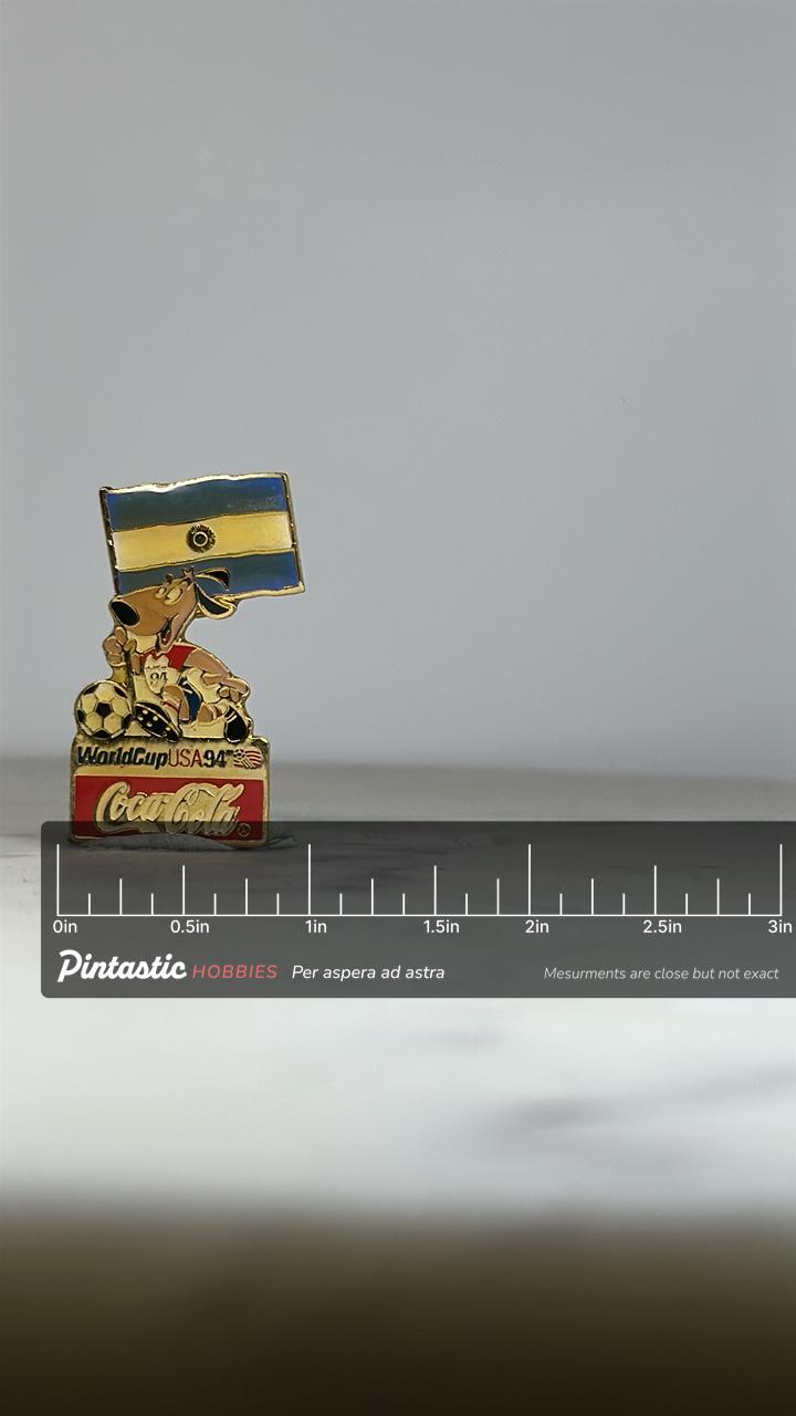 Argentina World Cup Enamel Pin: Gold/Multicolor - 1994 Soccer Accessory with ruler overlay for size reference