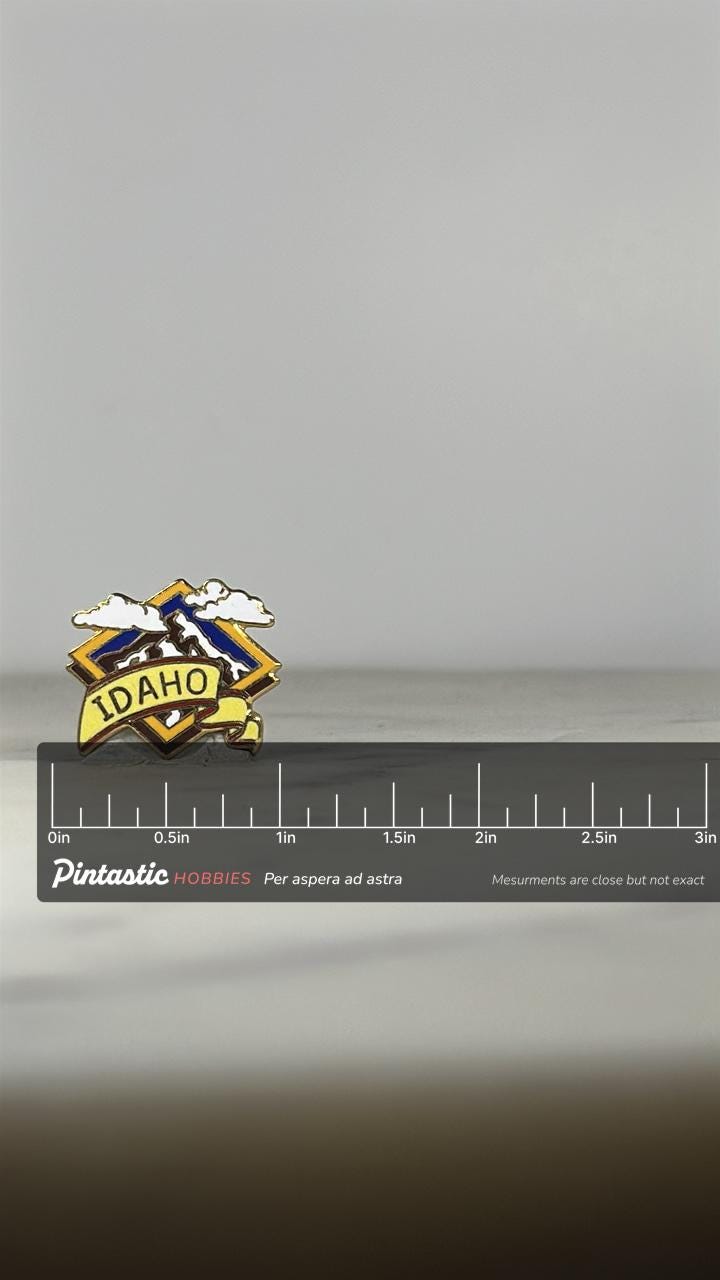 Idaho Souvenir Enamel Pin: Yellow & Blue Mountains - Vintage Travel Accessory with ruler overlay for size reference
