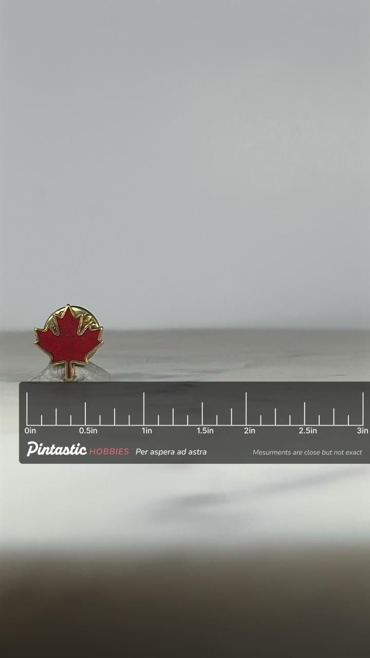 Canada Maple Leaf Lapel Pin: Red Enamel Gold Trim - Patriotic Accessory with ruler overlay for size reference