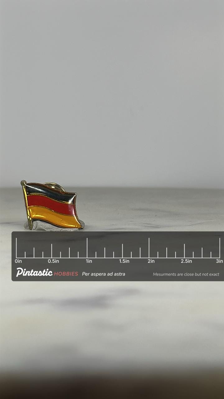 Germany Flag Enamel Pin: Gold Trim 3-Color - Vintage Travel Accessory with ruler overlay for size reference