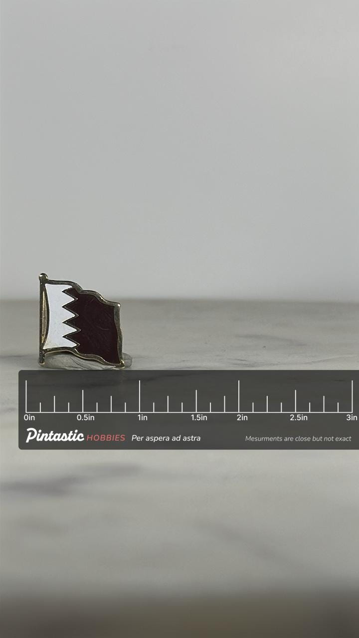Qatar Flag Enamel Pin: Maroon & White Metal - Vintage Travel Accessory with ruler overlay for size reference