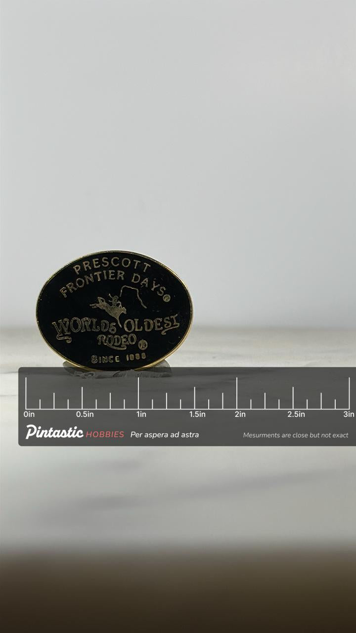 Prescott Frontier Days Rodeo Pin: Black & Gold Enamel - Western Heritage Accessory with ruler overlay for size reference
