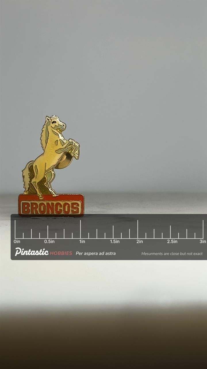 NFL Broncos Horse Enamel Pin: Gold & Red Finish - Vintage Sports Accessory with ruler overlay for size reference