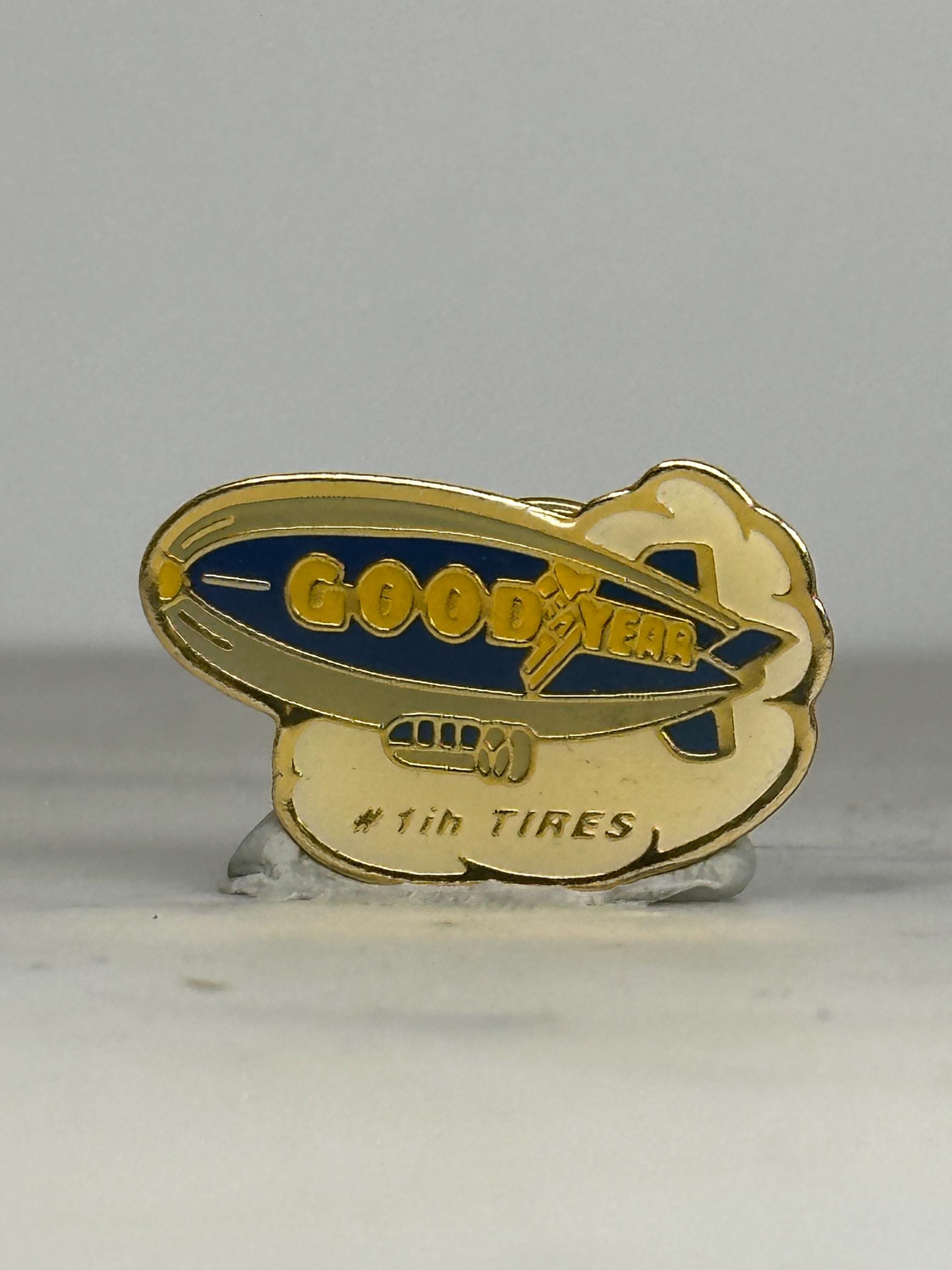 Goodyear Blimp Enamel Pin: Gold & Blue Logo - Retro Company Accessory
