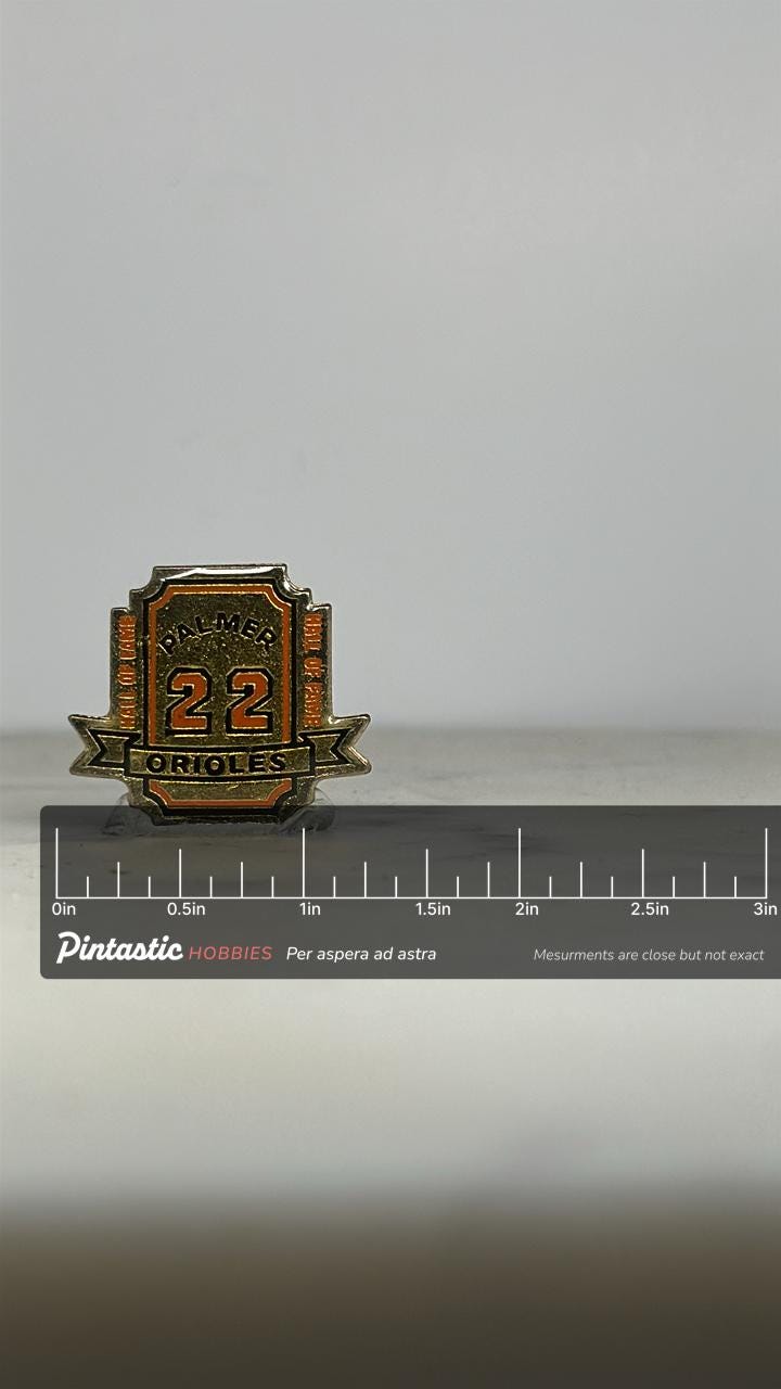 Palmer Orioles Enamel Pin: Gold & Orange Hall of Fame - Vintage Sports Accessory with ruler overlay for size reference