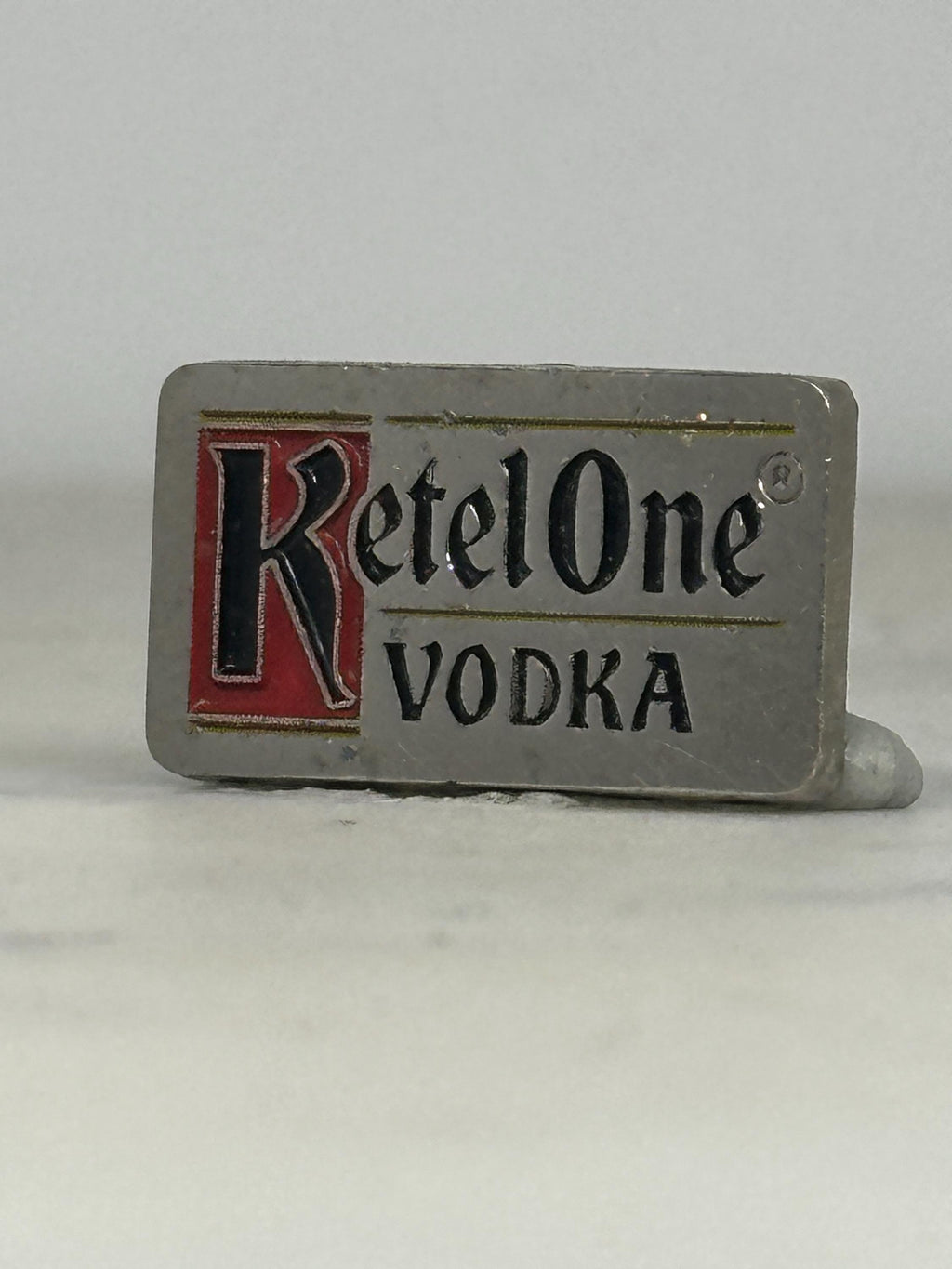 Ketel One Vodka Pin: Silver Enamel Logo - Vintage Barware Accessory
