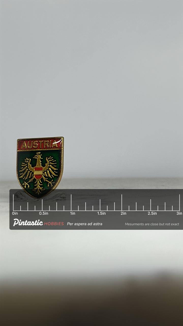 Austria Coat of Arms Pin: Glossy Enamel Shield - Vintage Travel Accessory with ruler overlay for size reference