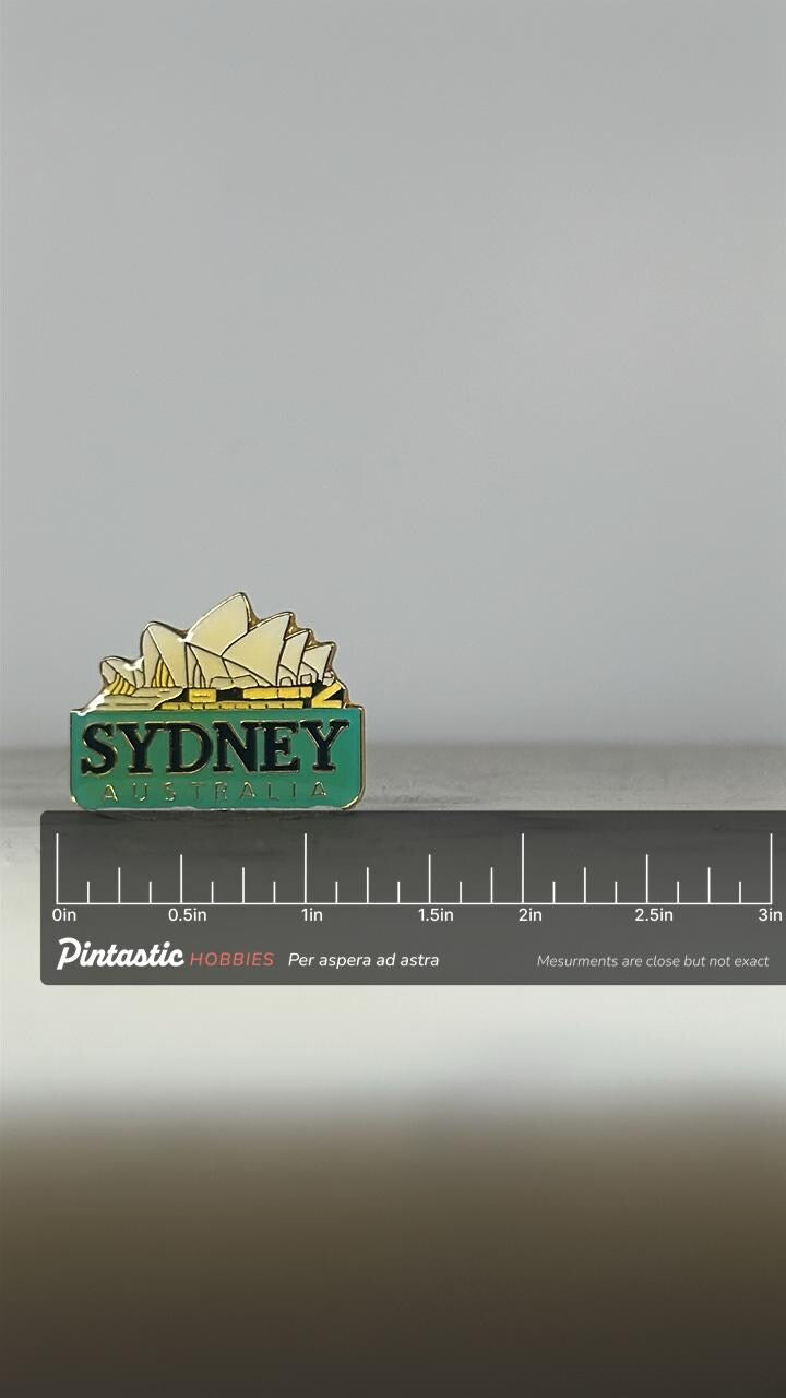 Sydney Australia Enamel Pin: Gold & Green Finish - Travel Souvenir Accessory with ruler overlay for size reference