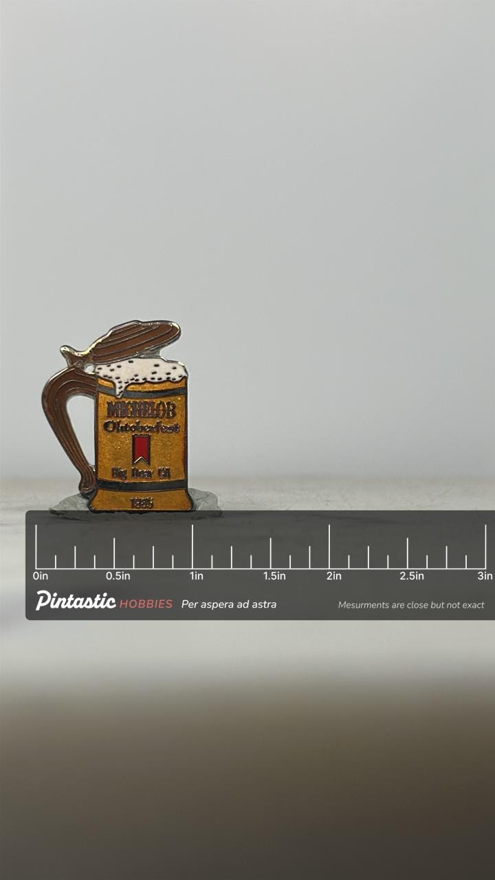 Michelob Oktoberfest Enamel Pin: Beer Stein Design - 1985 Event Accessory with ruler overlay for size reference
