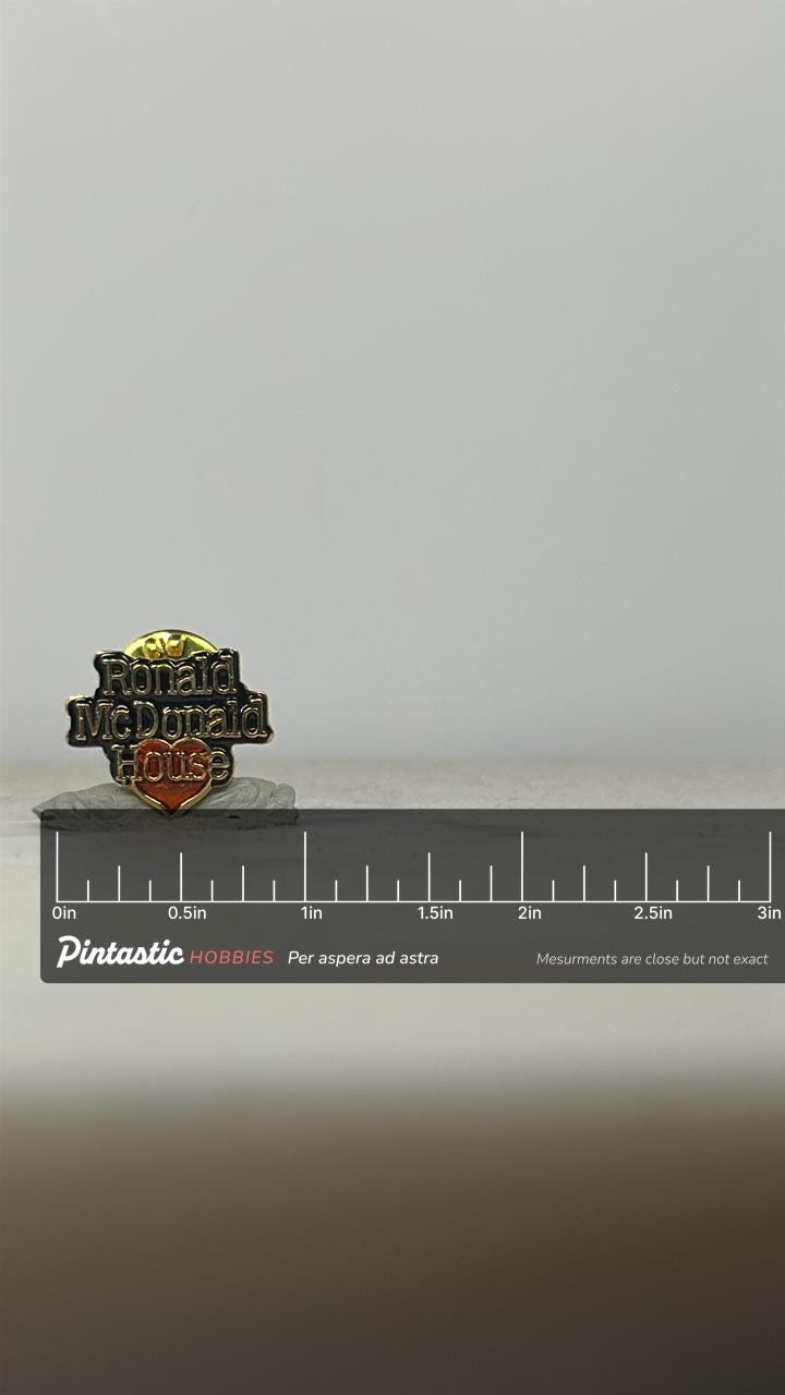 Ronald McDonald House Pin: Gold & Red Enamel - Charity Theme Accessory with ruler overlay for size reference