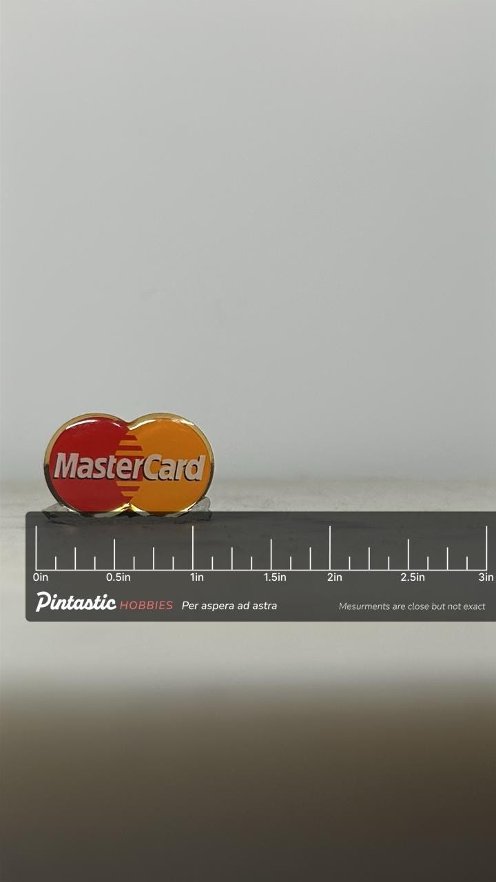 MasterCard Logo Pin: Red & Yellow Enamel - Vintage Corporate Accessory with ruler overlay for size reference