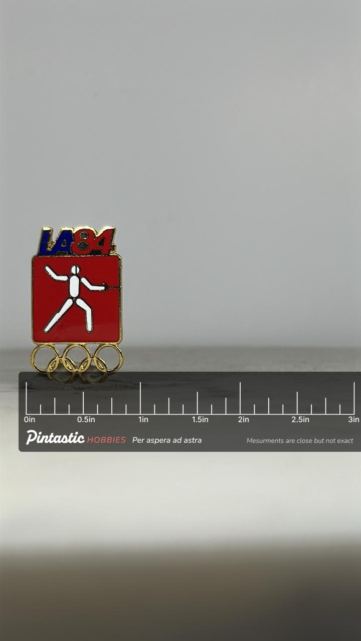 LA 1984 Olympic Fencing Pin: Red & Gold Enamel - Vintage Sports Accessory with ruler overlay for size reference