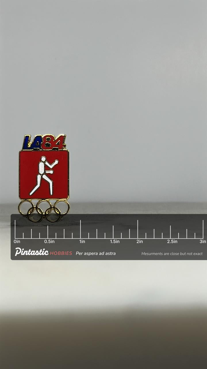 LA 1984 Olympic Boxing Pin: Red Enamel Gold Finish - Vintage Sports Accessory with ruler overlay for size reference