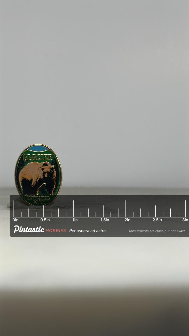Glacier National Park Enamel Pin: Gold Trim Bear Design - Vintage Travel Accessory with ruler overlay for size reference