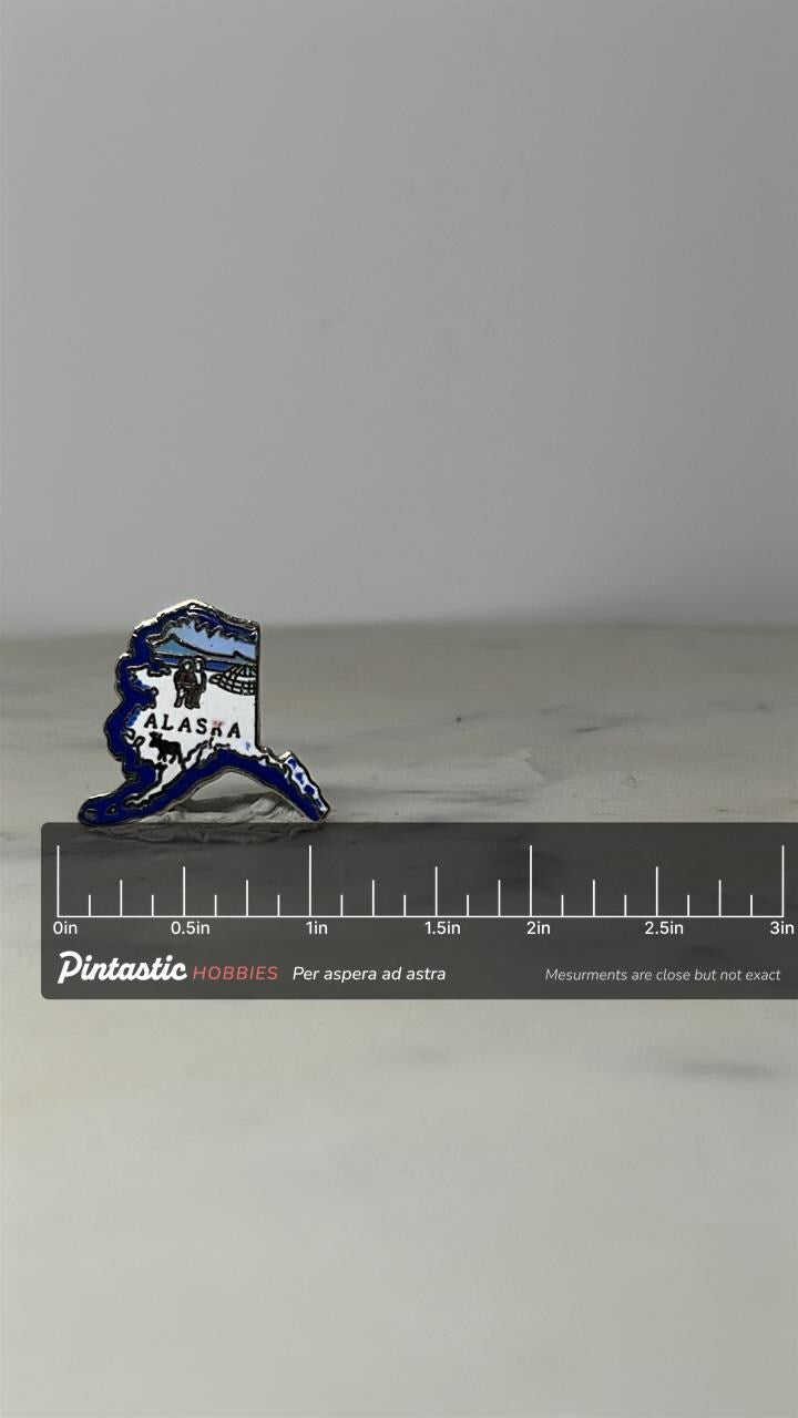 Alaska State Souvenir Pin: Blue Enamel Outline - Vintage Travel Accessory with ruler overlay for size reference