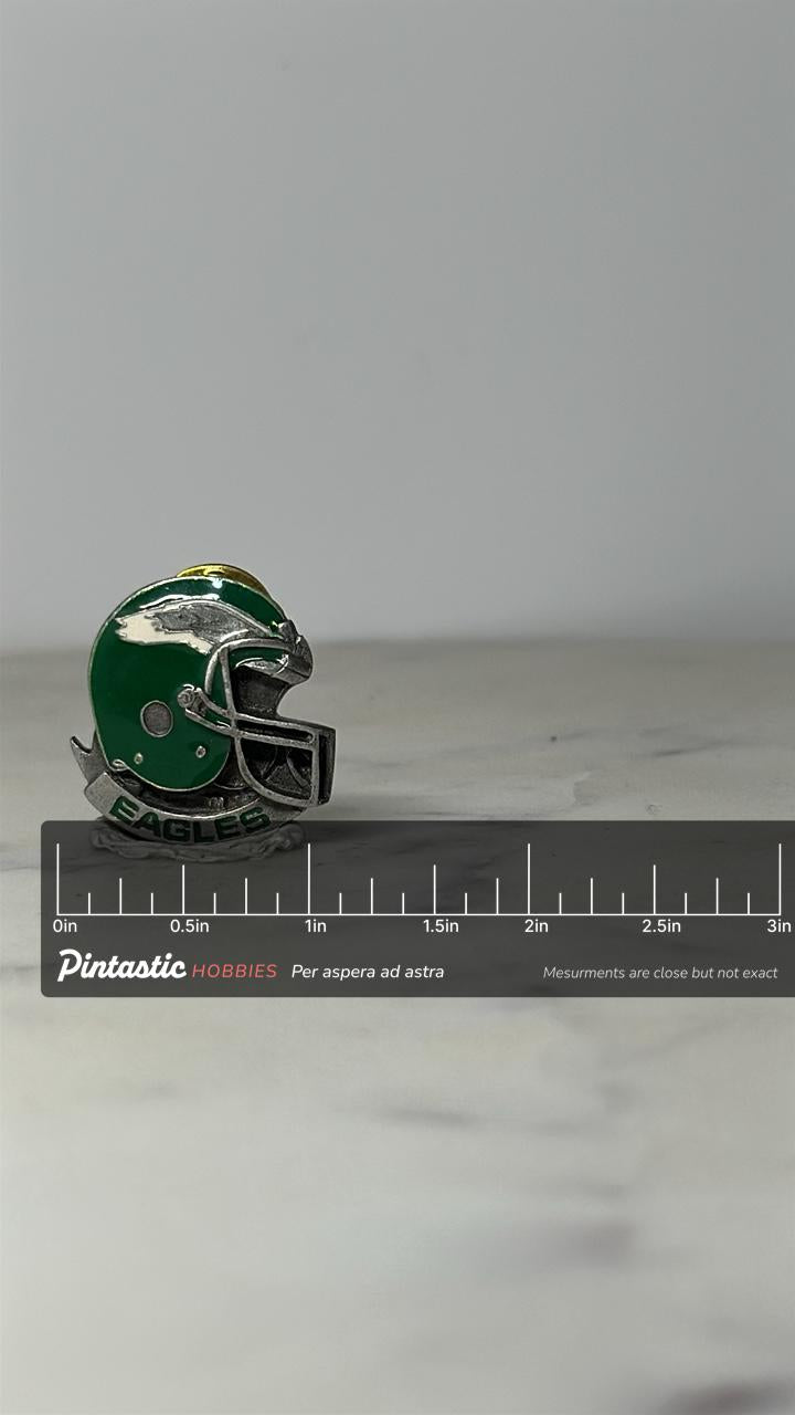 Philadelphia Eagles Helmet Pin: Green Silver Enamel - Vintage Sports Accessory with ruler overlay for size reference