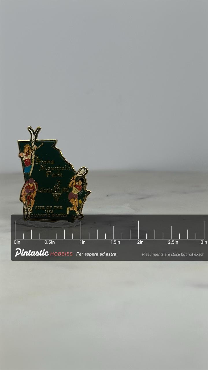 Stone Mountain Park Olympic Pin: Gold Enamel - 1996 Atlanta Games Accessory with ruler overlay for size reference