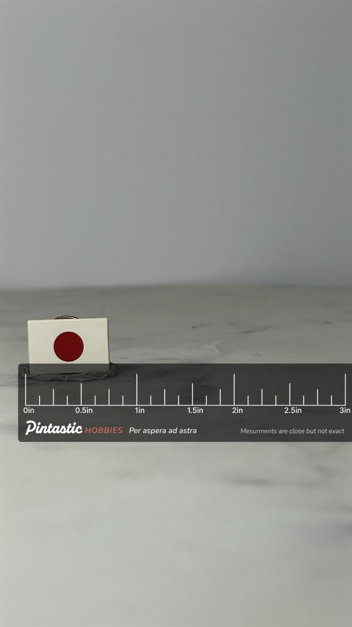 Japan Flag Pin: Red & White Enamel - Vintage National Accessory with ruler overlay for size reference