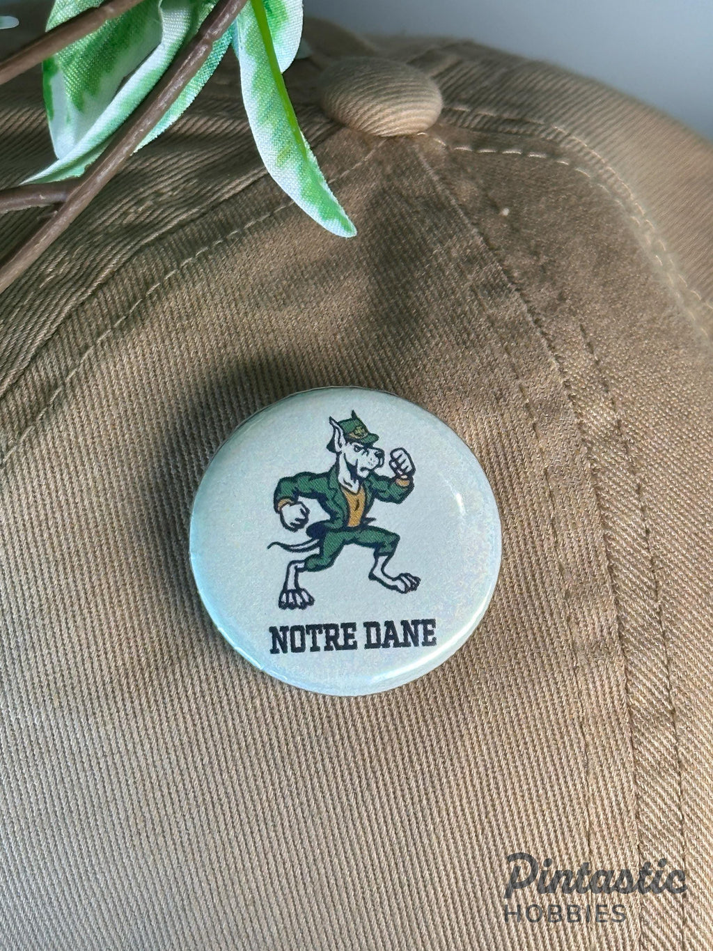Notre Dame Inspired "Notre Dane" 1.25 Inch Button Pin | University Style Parody Gift with ruler overlay for size reference