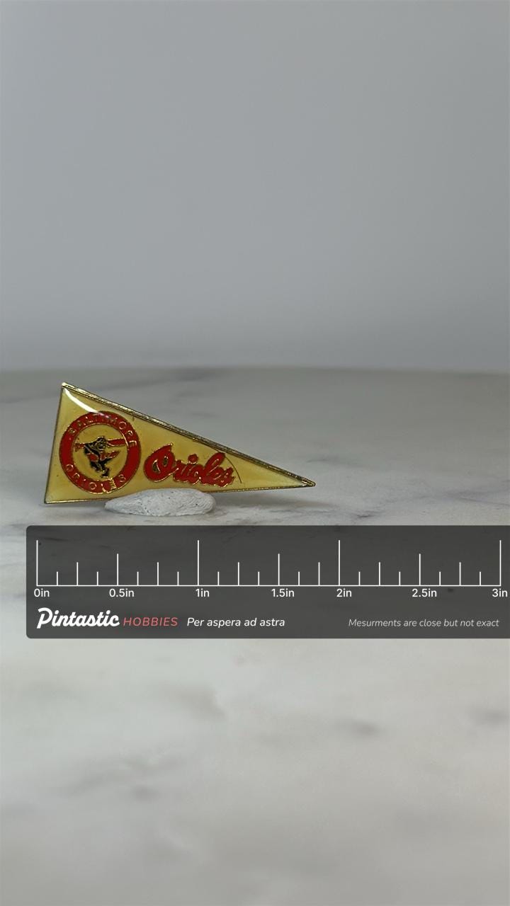 Baltimore Orioles Pennant Pin: Yellow Enamel Metal - Vintage Sports Accessory with ruler overlay for size reference