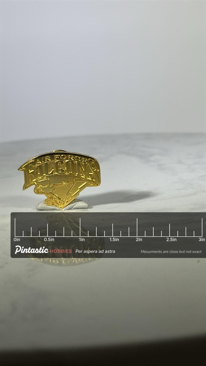 Air Force Falcons Pin: Gold Tone Emblem - Military Academy Accessory with ruler overlay for size reference