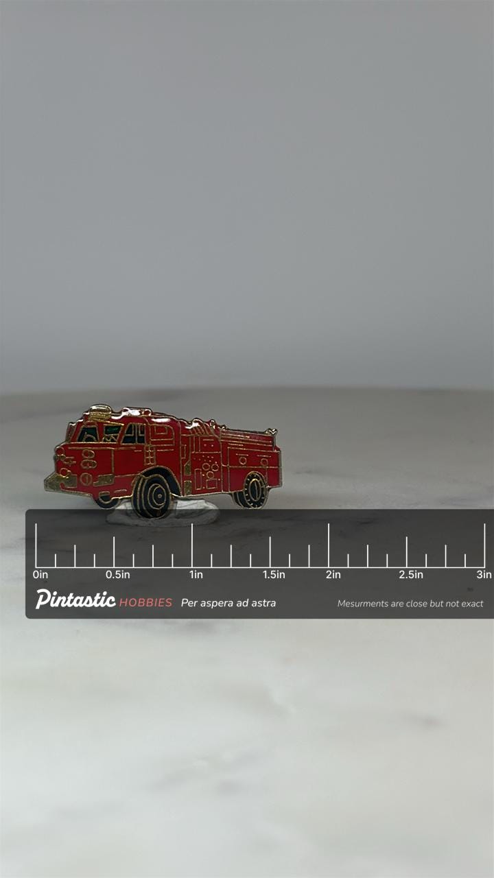Fire Truck Enamel Pin: Red Goldtone - Vintage Firefighter Accessory with ruler overlay for size reference
