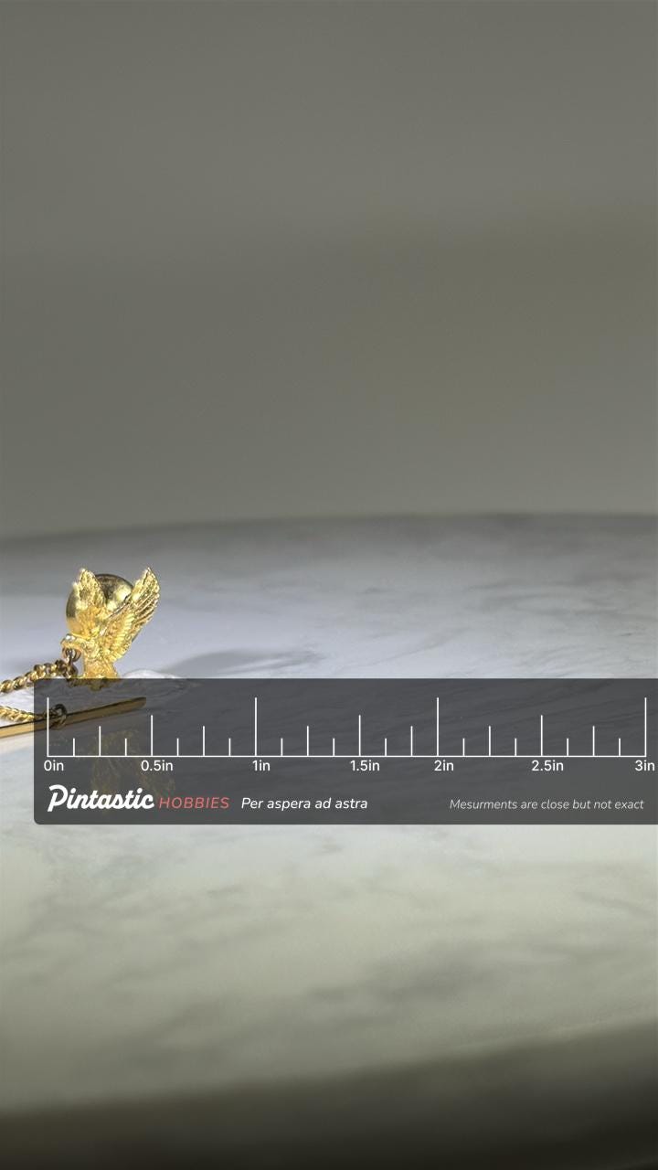 Gold Eagle Tie Tack: Bold Metallic Finish - Patriotic Accessory with ruler overlay for size reference