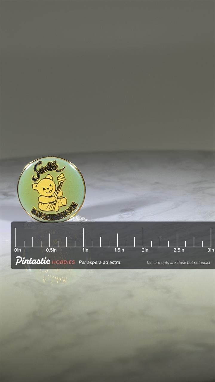 Seattle Bear Souvenir Pin: Gold Enamel - Cute Travel Accessory with ruler overlay for size reference