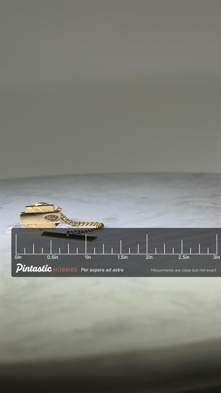 Ford Tie Tack: Gold Tone Bar with Chain - Vintage Auto Accessory with ruler overlay for size reference