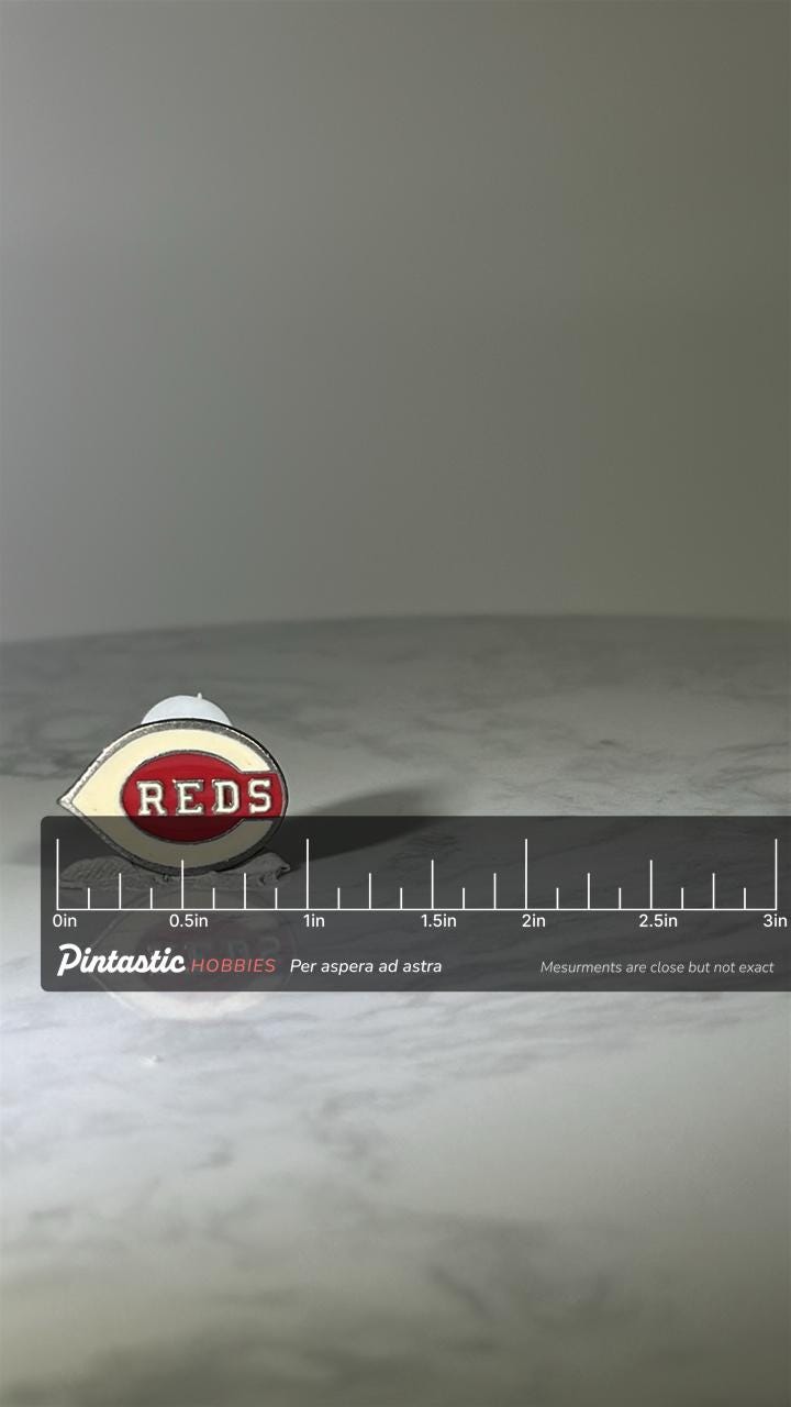Cincinnati Reds Baseball Pin: Red & White Enamel - Vintage Sports Accessory with ruler overlay for size reference