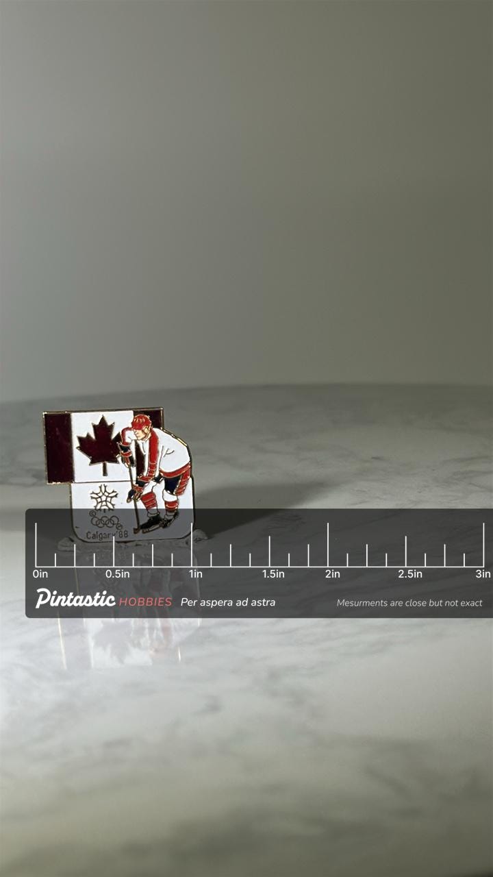 Calgary 1988 Hockey Pin: Enamel Canada Flag - Winter Olympics Accessory with ruler overlay for size reference