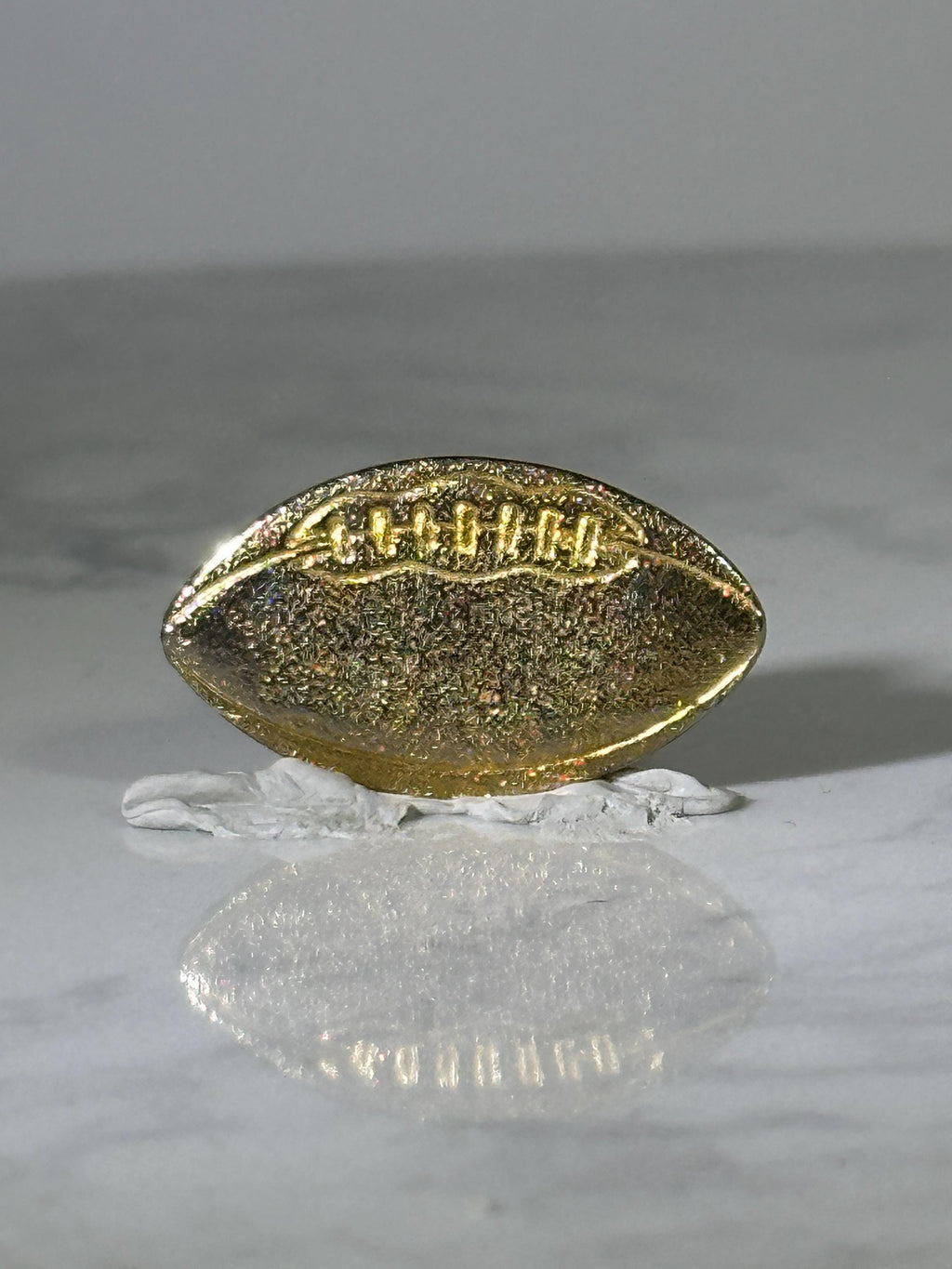 Football Shaped Pin: Textured Gold-Tone - Classic Sports Accessory