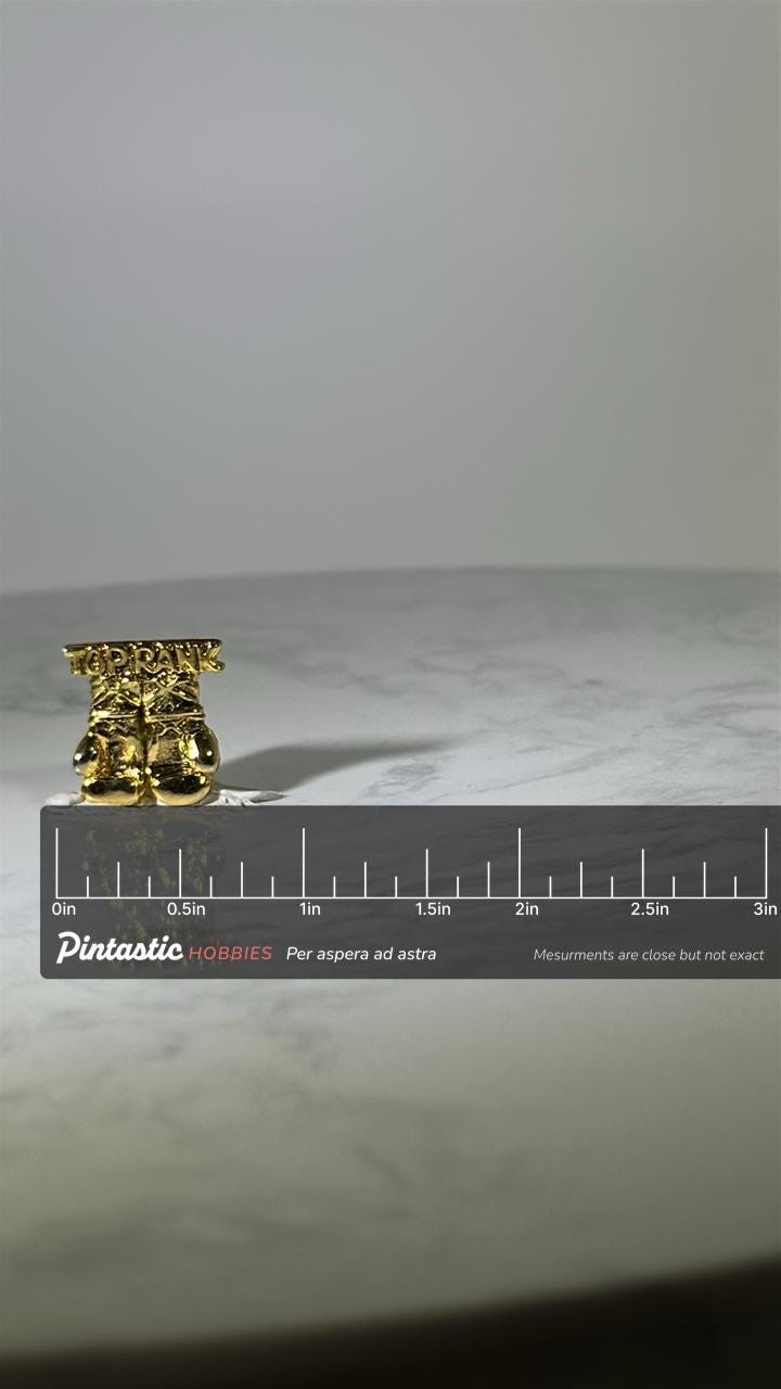Top Rank Boxing Pin: Gold Finish - Vintage Sports Accessory with ruler overlay for size reference